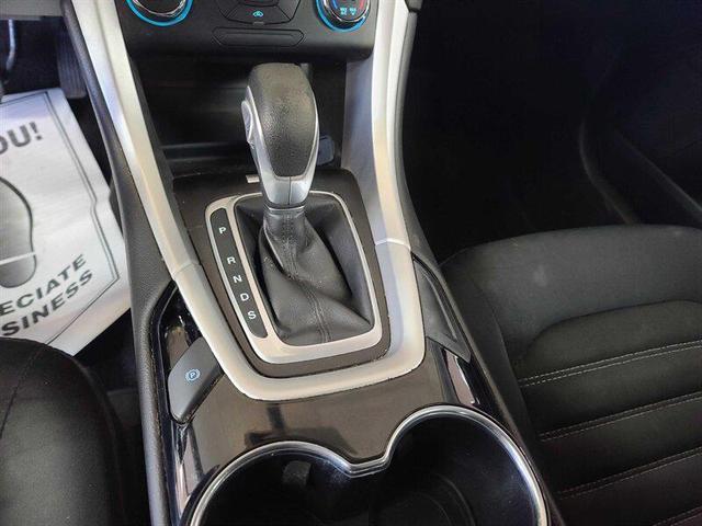 Photo of 2014 Ruby Red Metallic Tinted Clearcoat Ford Fusion