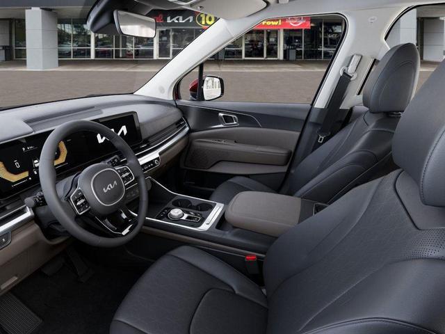 Photo of 2026 Flare Red Kia Carnival Hybrid