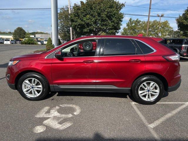 Photo of 2016 Ruby Red Metallic Tinted Clearcoat Ford Edge