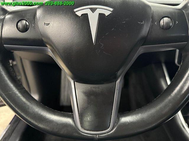 Photo of 2018 Deep Blue Metallic Tesla Model 3