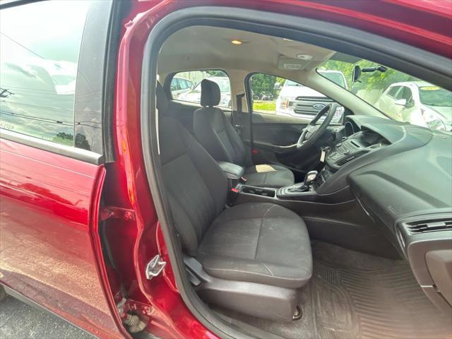 Photo of 2016 Ruby Red Metallic Tinted Clearcoat Ford Focus
