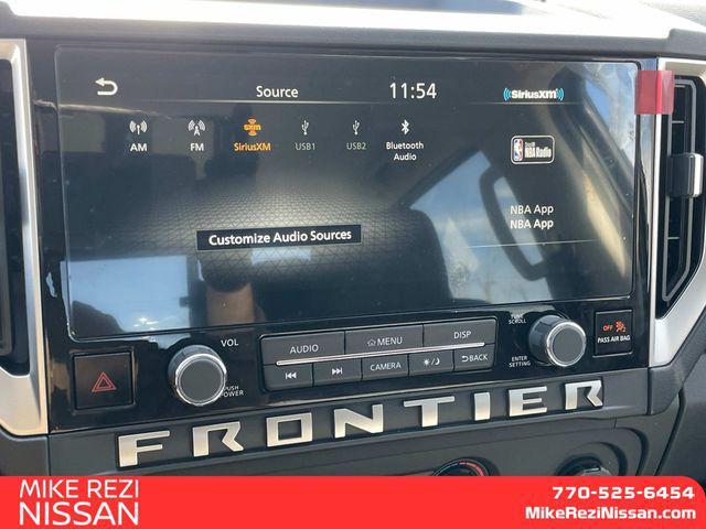 Photo of 2025 Glacier White Nissan Frontier