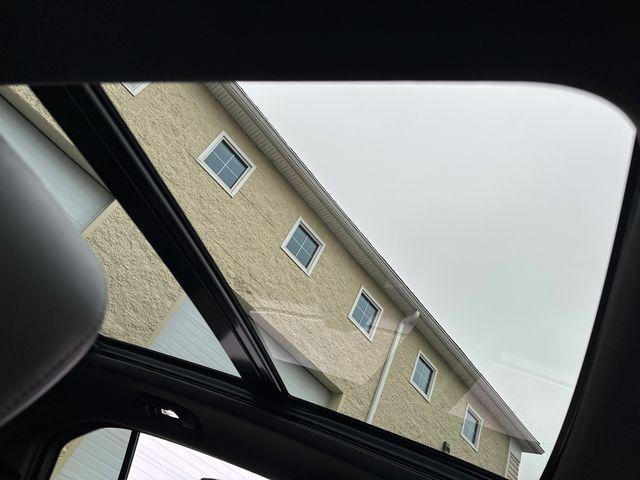 Photo of 2023 Crystal White Tricoat Cadillac XT4