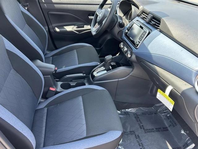 Photo of 2025 Aspen White Tricoat Nissan Versa