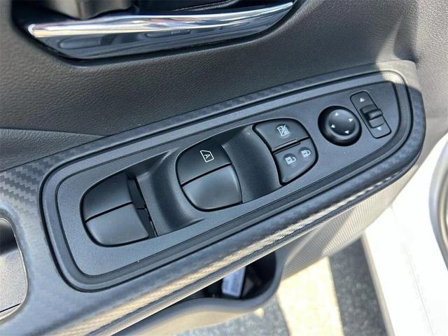 Photo of 2025 Aspen White Tricoat Nissan Versa