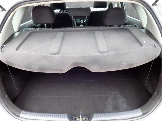 Photo of 2011 Bright Silver Metallic Kia Forte