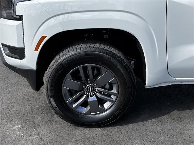 Photo of 2025 Glacier White Nissan Frontier