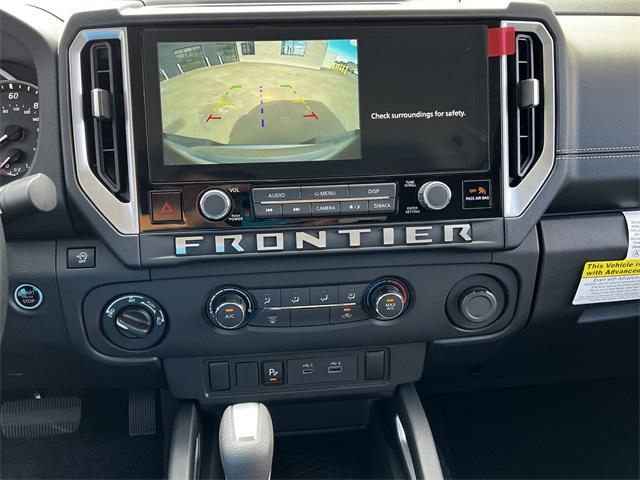 Photo of 2025 Glacier White Nissan Frontier