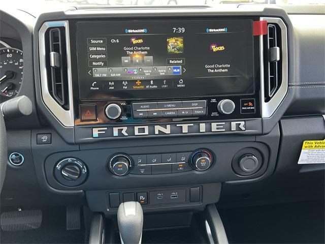 Photo of 2025 Glacier White Nissan Frontier