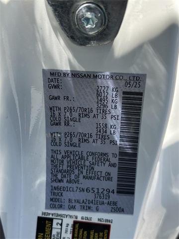 Photo of 2025 Glacier White Nissan Frontier