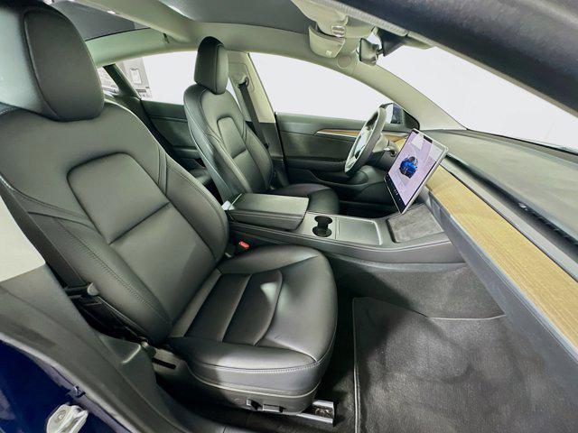 Photo of 2023 Deep Blue Metallic Tesla Model 3