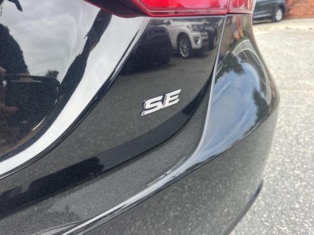 Photo of 2024 Midnight Black Metallic Toyota Camry