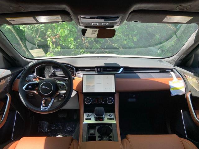 Photo of 2025 Ostuni Pearl White Jaguar F-PACE