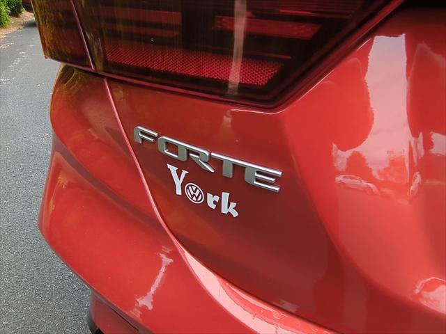 Photo of 2023 Fire Orange Kia Forte