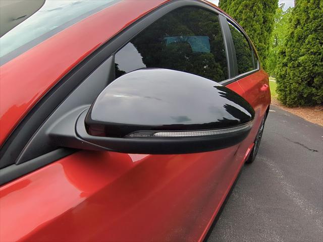 Photo of 2023 Fire Orange Kia Forte