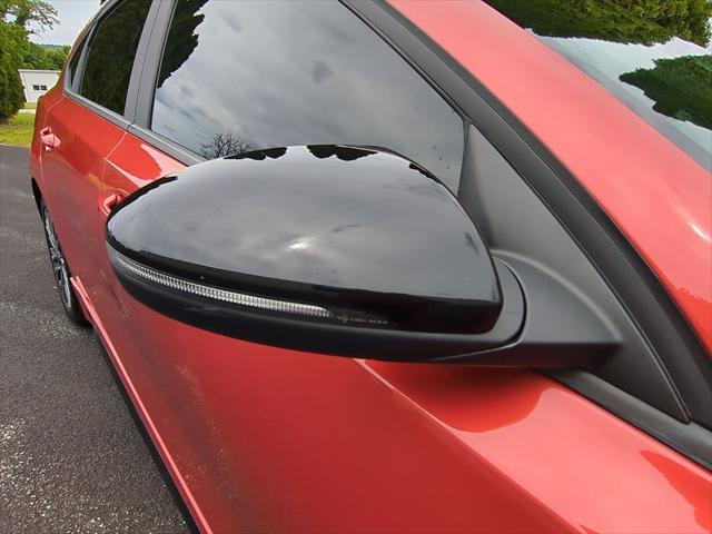 Photo of 2023 Fire Orange Kia Forte