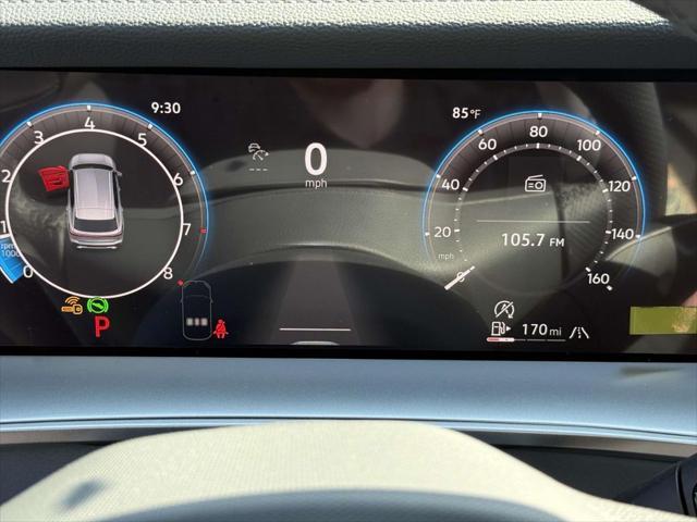 Photo of 2025 Opal White w/Deep Black Roof Volkswagen Tiguan