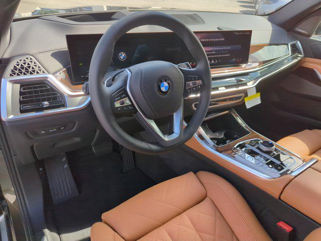 Photo of 2026 Manhattan Green Metallic BMW X5