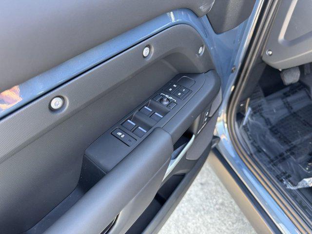 Photo of 2025 Tasman Blue Metallic Land Rover Defender