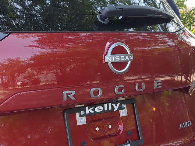 Photo of 2026 Scarlet Ember Tintcoat Nissan Rogue