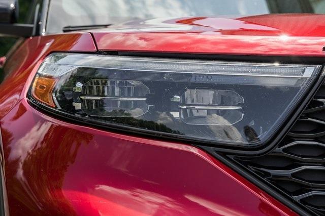 Photo of 2024 Rapid Red Metallic Tinted Clearcoat Ford Explorer