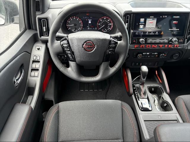 Photo of 2025 Glacier White Nissan Frontier