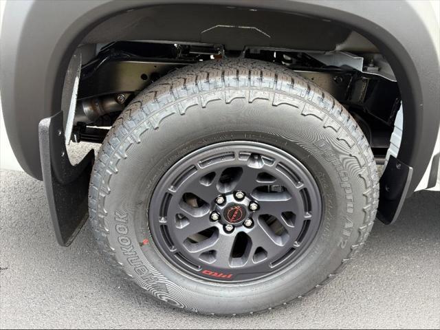 Photo of 2025 Glacier White Nissan Frontier