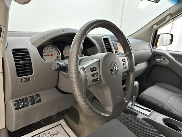 Photo of 2015 Lava Red Nissan Frontier