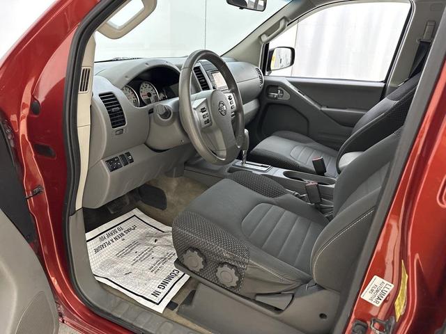 Photo of 2015 Lava Red Nissan Frontier