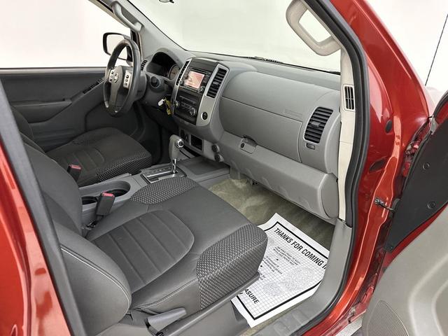 Photo of 2015 Lava Red Nissan Frontier