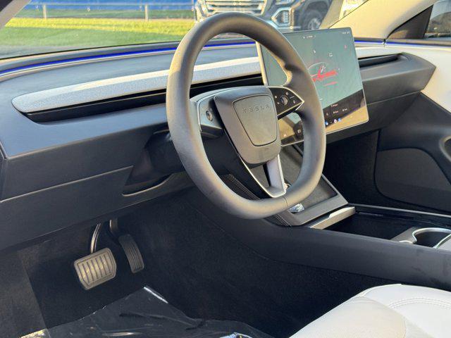 Photo of 2025 Black Tesla Model 3