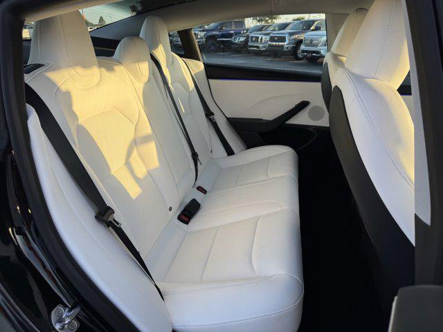 Photo of 2025 Black Tesla Model 3