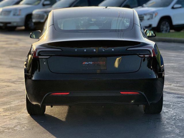 Photo of 2025 Black Tesla Model 3