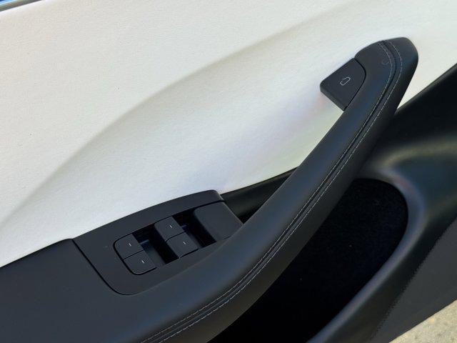 Photo of 2025 Black Tesla Model 3