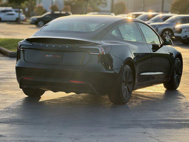Photo of 2025 Black Tesla Model 3