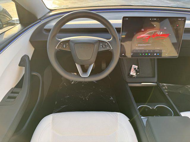 Photo of 2025 Black Tesla Model 3