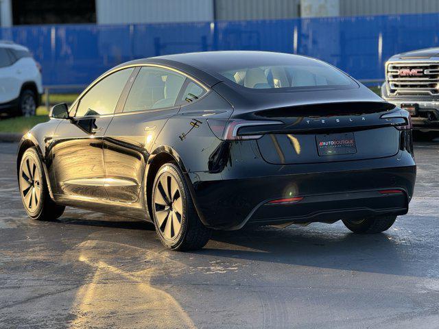Photo of 2025 Black Tesla Model 3