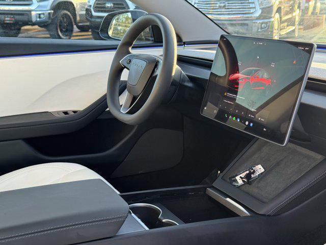 Photo of 2025 Black Tesla Model 3