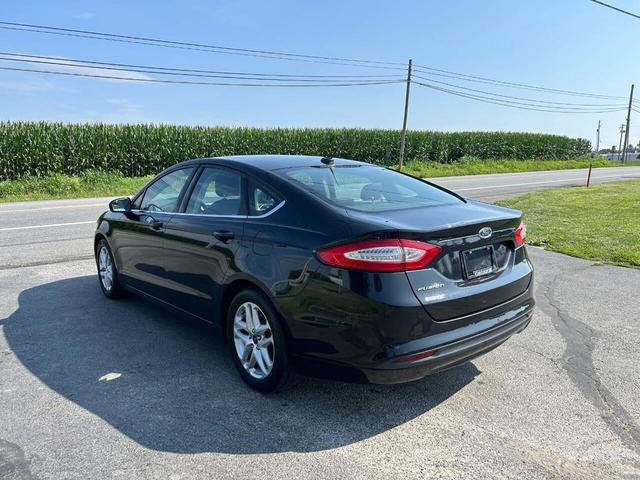 Photo of 2014 Tuxedo Black Metallic Ford Fusion