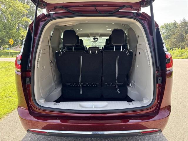 Photo of 2023 Burgundy Chrysler Pacifica Hybrid