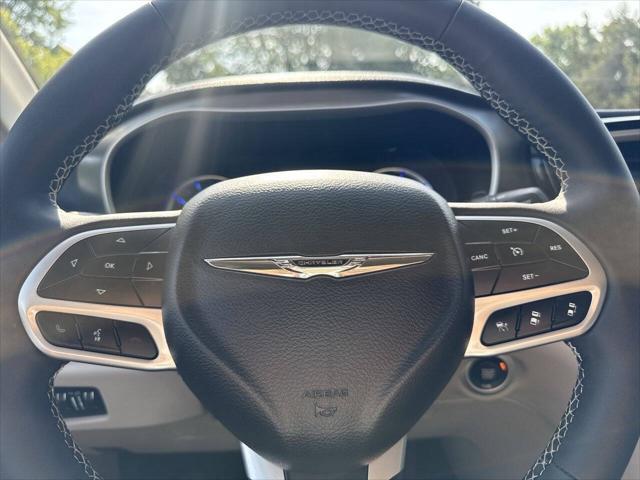 Photo of 2023 Burgundy Chrysler Pacifica Hybrid
