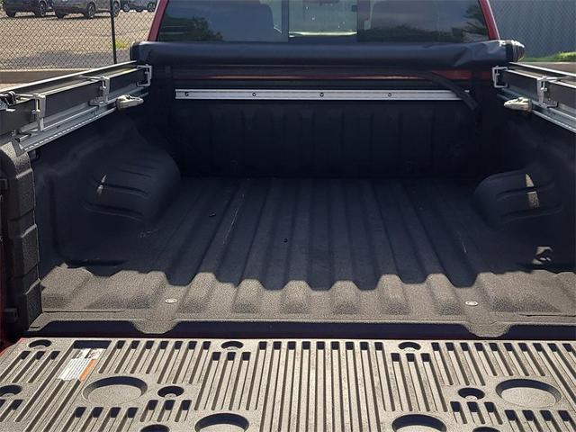 Photo of 2024 Cardinal Red Metallic Nissan Frontier