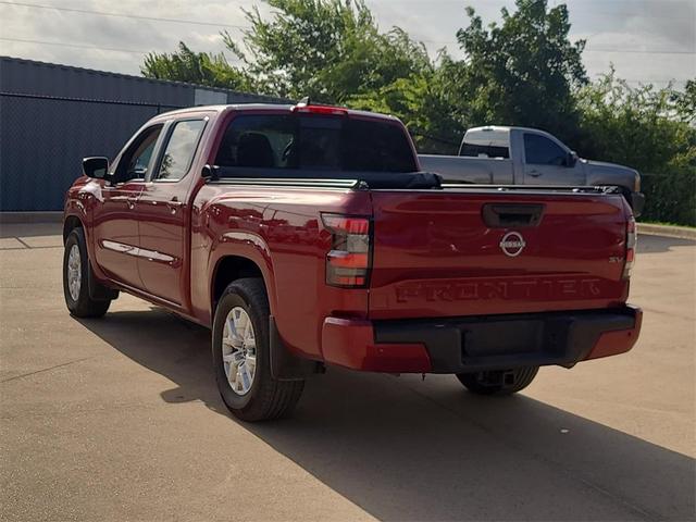 Photo of 2024 Cardinal Red Metallic Nissan Frontier