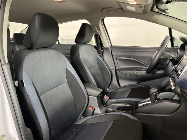 Photo of 2025 Aspen White Tricoat Nissan Versa