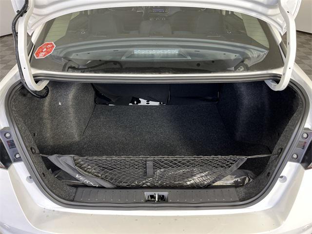 Photo of 2025 Aspen White Tricoat Nissan Versa