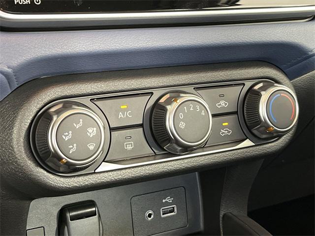 Photo of 2025 Aspen White Tricoat Nissan Versa