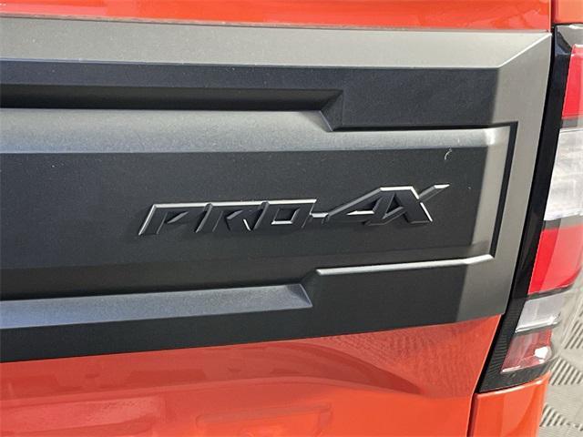 Photo of 2025 Afterburn Orange Nissan Frontier