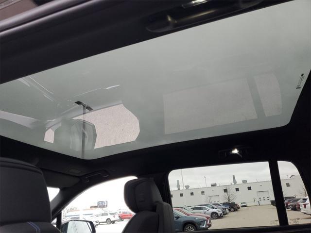 Photo of 2025 Black Raven Cadillac Escalade IQ