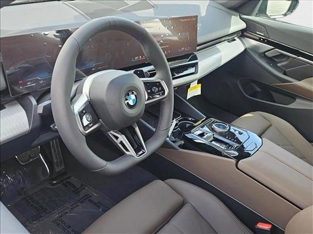 Photo of 2025 Carbon Black Metallic BMW 530