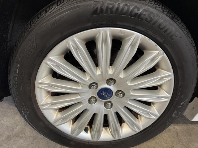 Photo of 2015 White Ford Fusion Hybrid